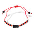 The Genuine Azabache Fist Red Rope Evil Eye Bracelet for Adult protection is designed as a spiritual shield with a red string and alternating black and red beads, featuring a prominent black bead at its center. It combines both style and protection against the evil eye with adjustable knots on each end.